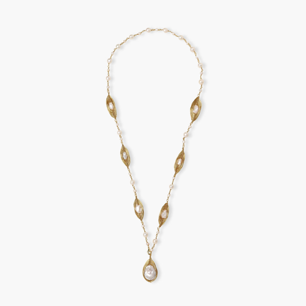 14K gold plated necklace with organic leaf motifs and freshwater pearls arranged in an elegant chain design on neutral background.