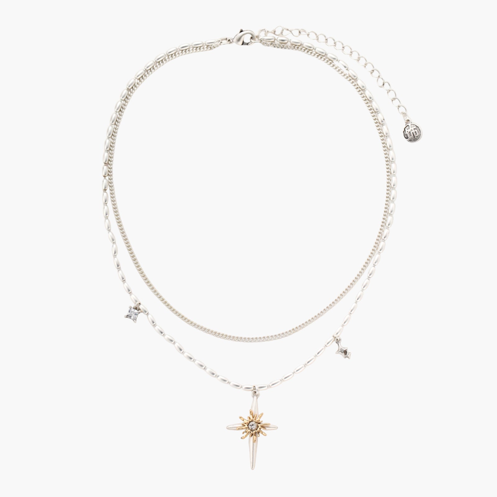 Two-layer silver-toned necklace with star charms and dagger pendant featuring golden sun motif on white background.