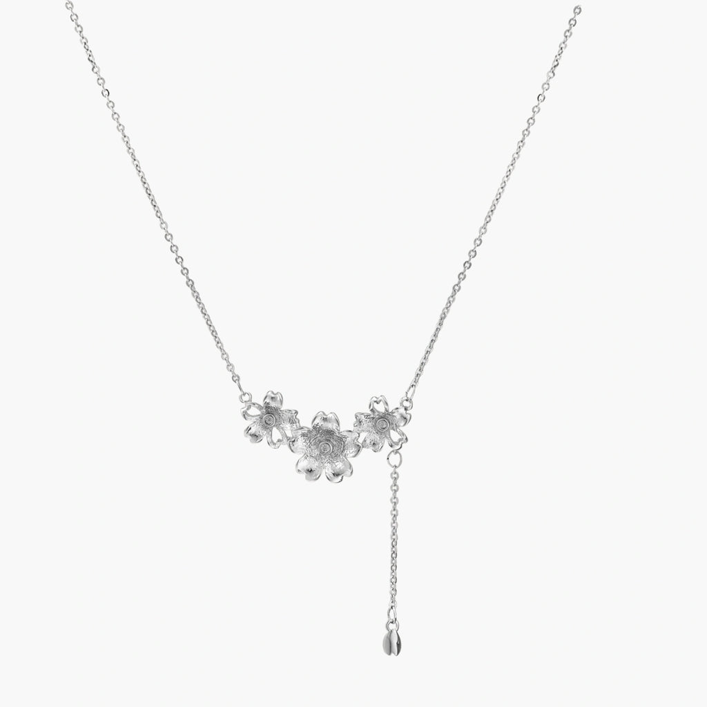 White gold plated Y-shaped necklace with three dimensional flower charms and adjustable drop pendant